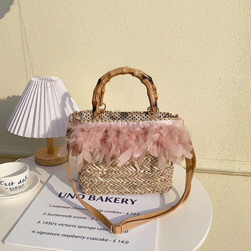 Elegant handbag with feathers and bamboo handle Skanto