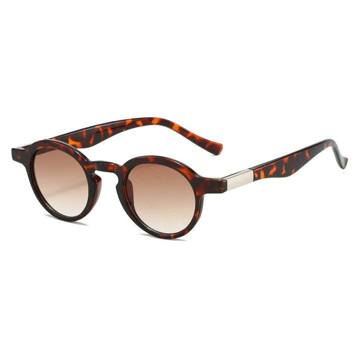 Dame eksklusiv solbrille i elegant skilpadde-design Skanto