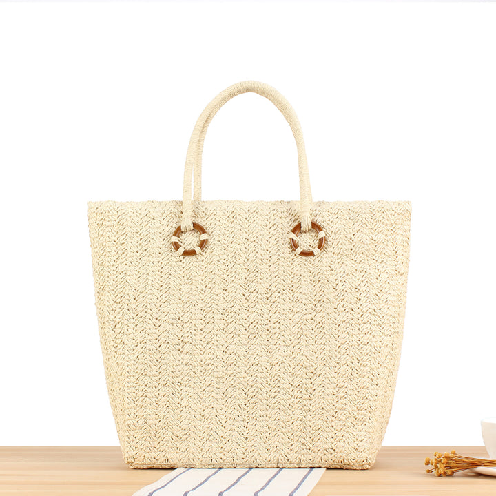 Beach bag in natural woven material with sturdy handles Skanto