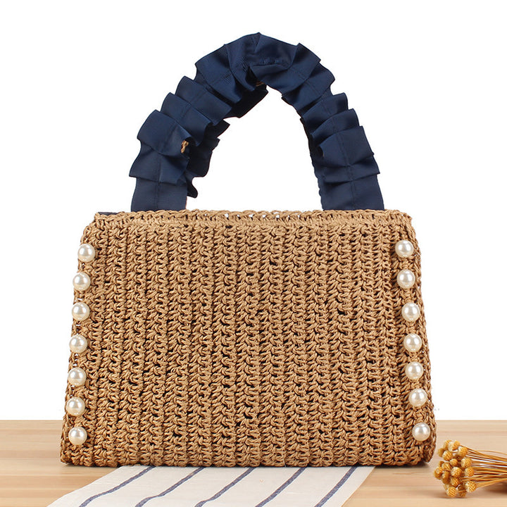 Elegant handbag with beaded decoration and ruffled handle Skanto