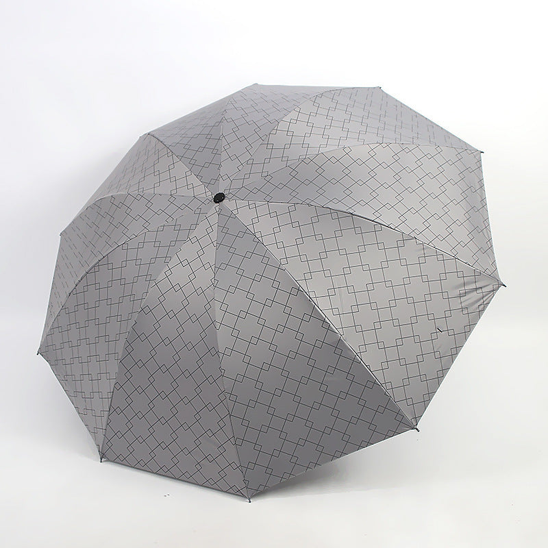 Kvinnenes sammenleggbare paraply med moderne geometrisk mønster Skanto