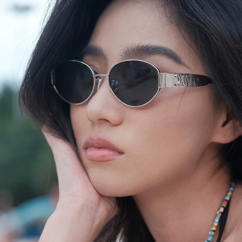 Women's fashionable sunglasses in elegant oval design with robust metal frame Skanto