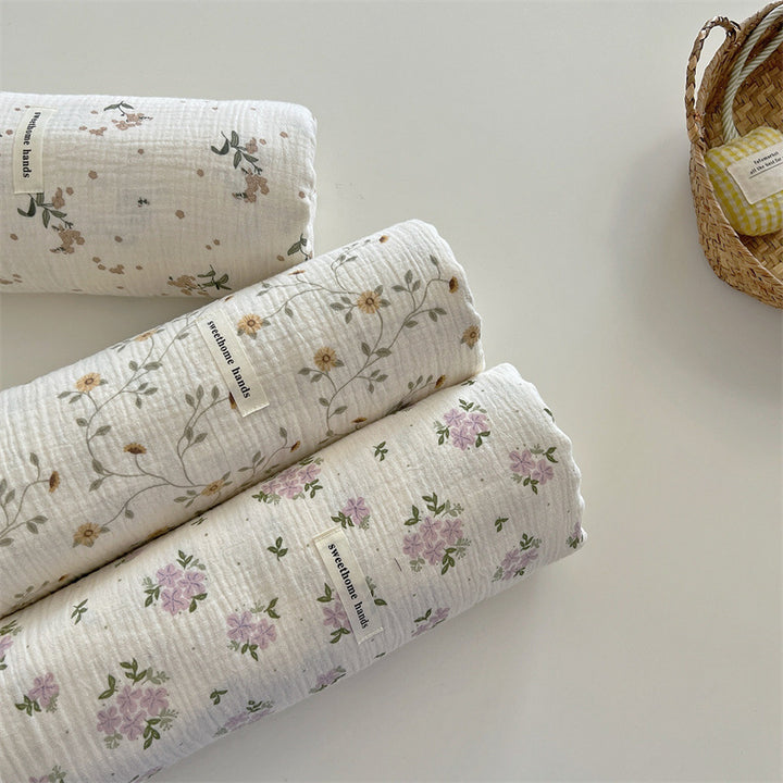 Unisex allsidig muslinteppe med blomstrete detaljer Skanto