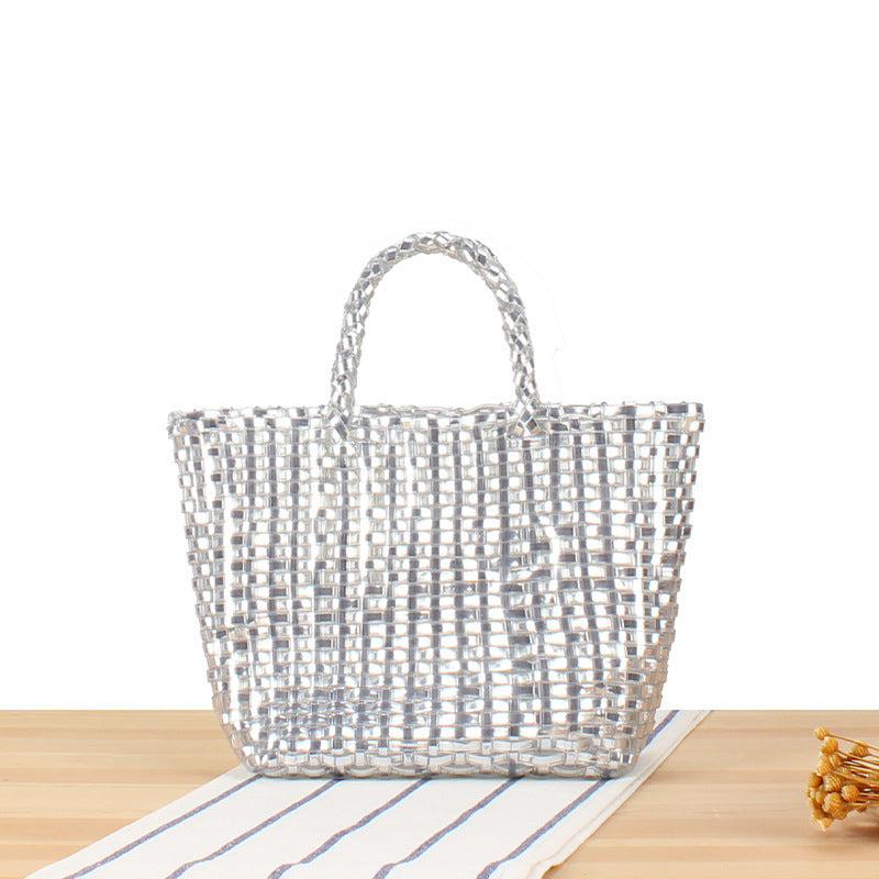 Handbag made of woven natural material with elegant accents Skanto