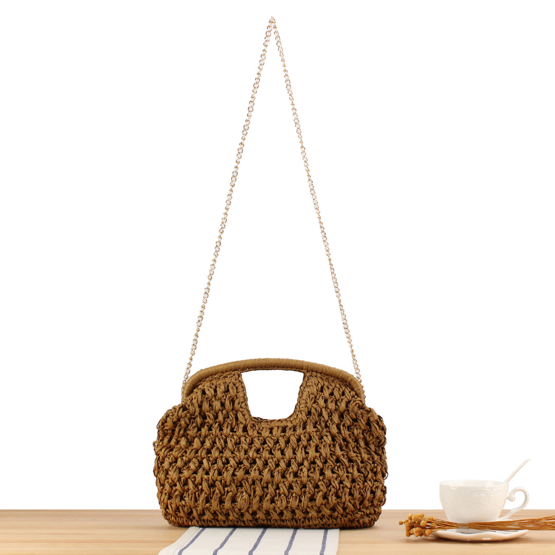 Handbag made of naturally coated braided material with elegant chain detail Skanto