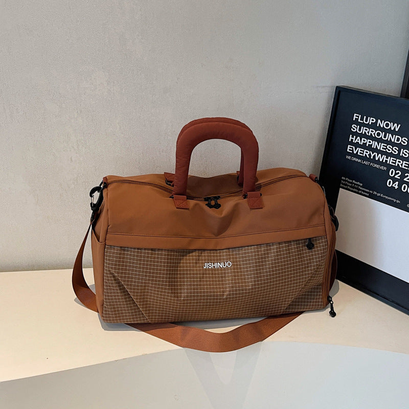 Sporty fritids-duffelbag med ergonomiske håndtak og flere rom Skanto