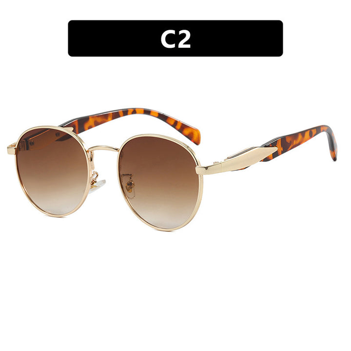 Dame rund solbrille med elegant, gullramme og UV-beskyttelse Skanto