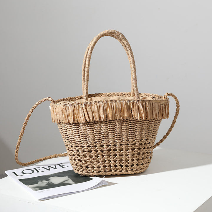 Braided straw bag with decorative tassel detail Skanto