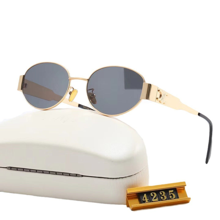 Dame elegant oval solbrille med gullfarget ramme Skanto