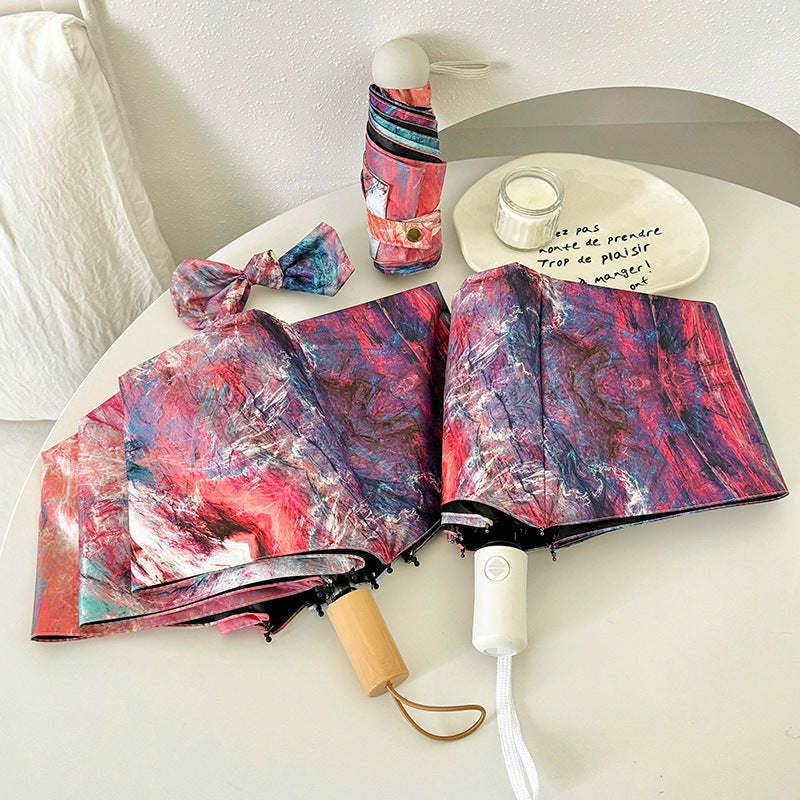 Dame sammenleggbart paraply med kreativt kunstdesign Skanto