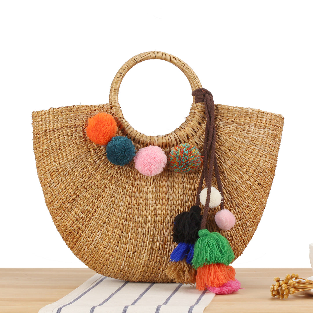 Straw handbag with colorful tassels and pom poms Skanto