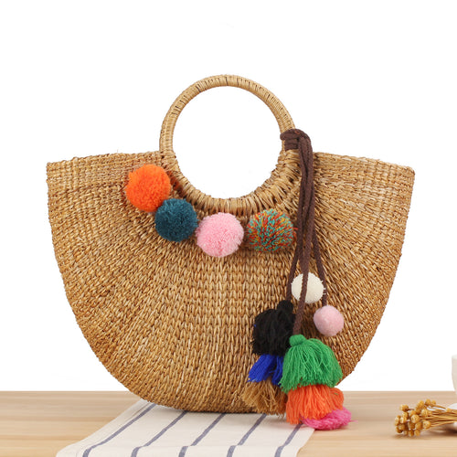 Straw handbag with colorful tassels and pom poms Skanto