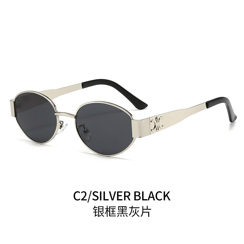Dame Designer-solbrille med elegant oval ramme og unike aksenter Skanto