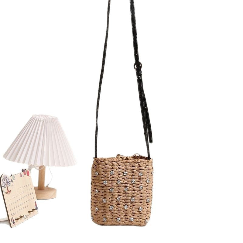 Woven natural material handbag with sparkling applications Skanto