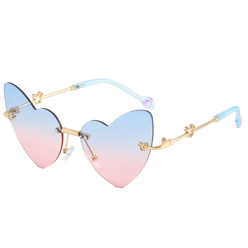 Damer hjerteformet solbrille med dekorert ramme Skanto