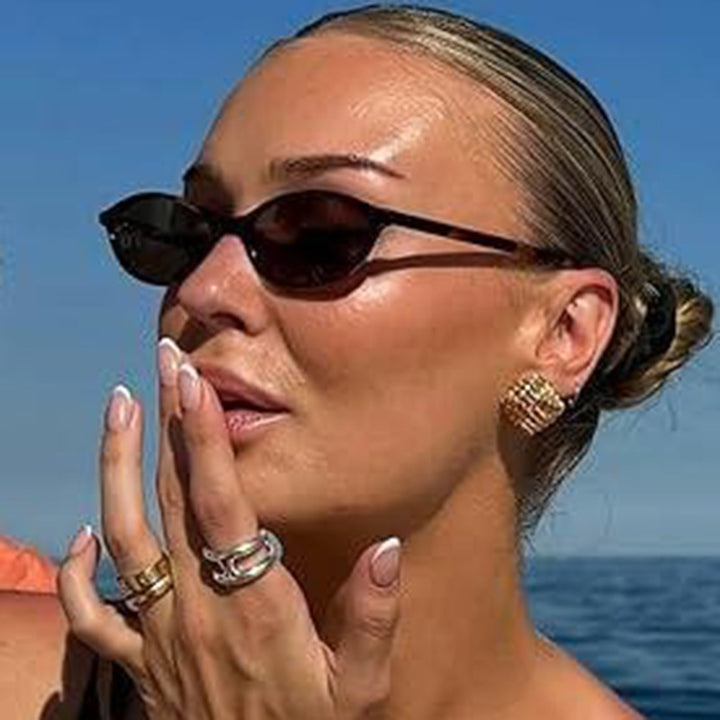 Women's oval sunglasses with transparent frame and UV protection Skanto