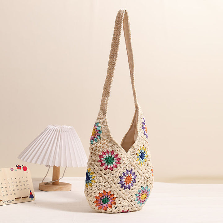 Handmade crocheted bag with colorful floral pattern Skanto