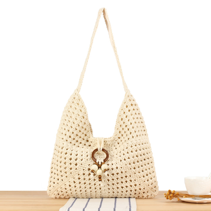 Handbag made of hand-knotted natural material with stylish fringe details Skanto