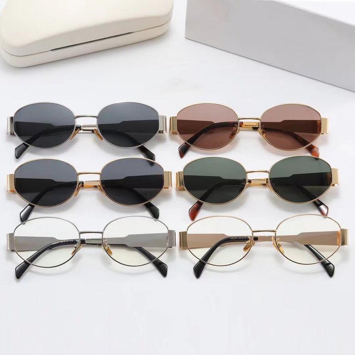 Dame elegant oval solbrille med gullfarget ramme Skanto