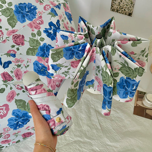 Dame folde paraply med høykvalitets blomsterdesign Skanto
