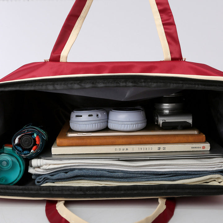 Sporty reisetasche med forsterkede håndtak og romslig interiør Skanto