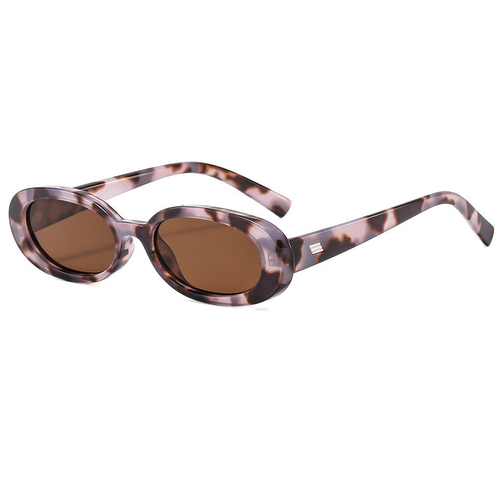 Dame stilfulle solbriller med oval ramme og trendy linser Skanto