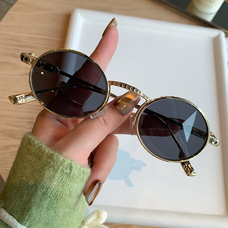 Dame Elegant solbrille med filigran detaljer Skanto