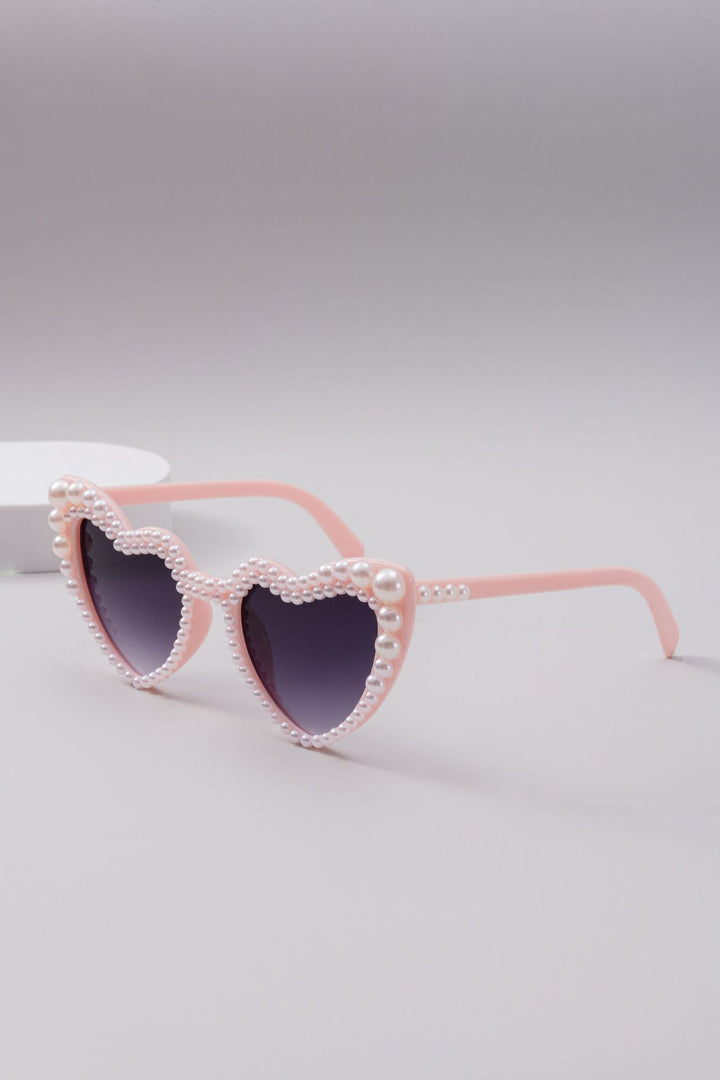 Dame designer solbrille med perleinnramming fra Skanto
