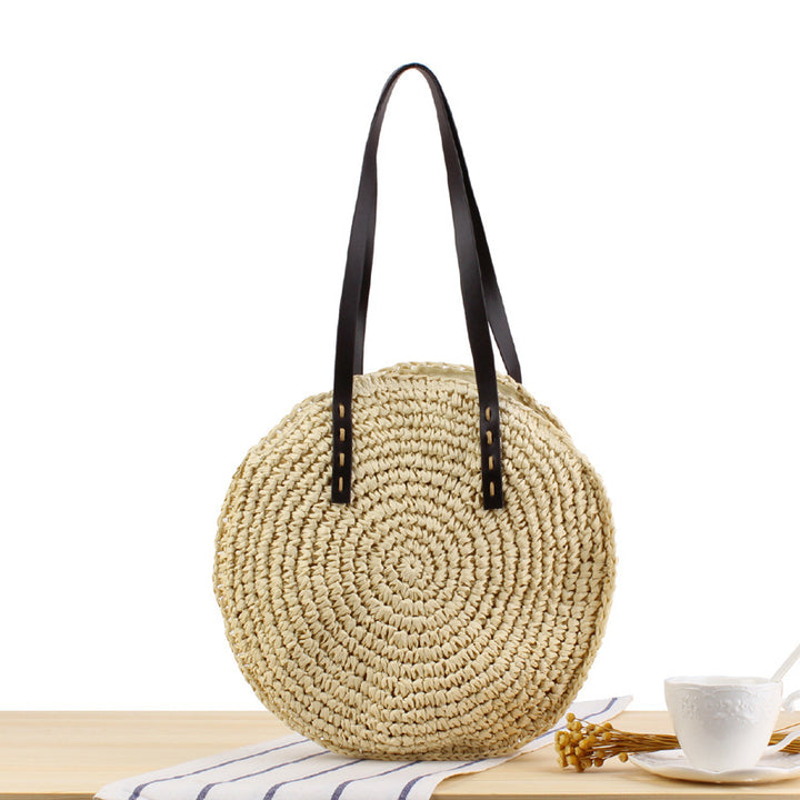 Round basket bag with sturdy leather handles Skanto