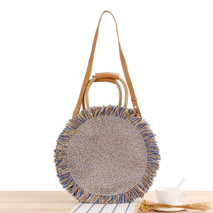Round bag with fringe detail Made of braided material Skanto