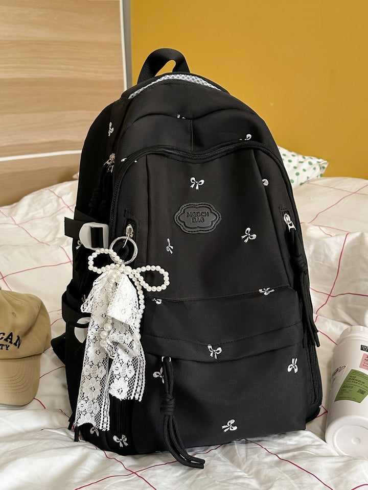 Detaljert brodert skole ryggsekk