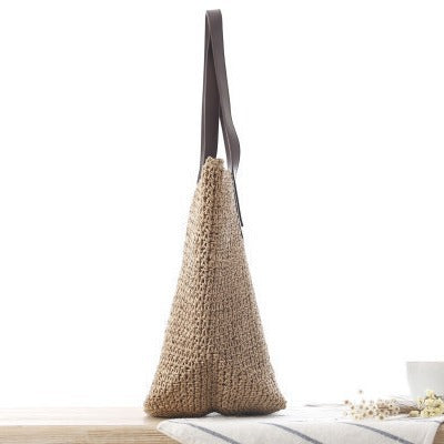 Woven natural material handbag with sturdy leather handles Skanto