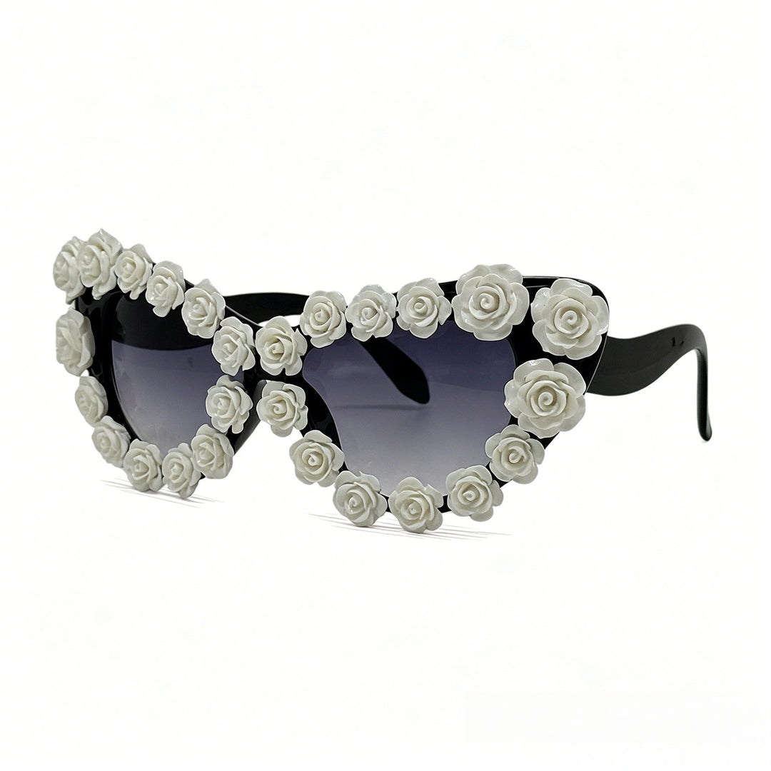 Damen hjerteformet solbrille med blomsterapplikasjon Skanto