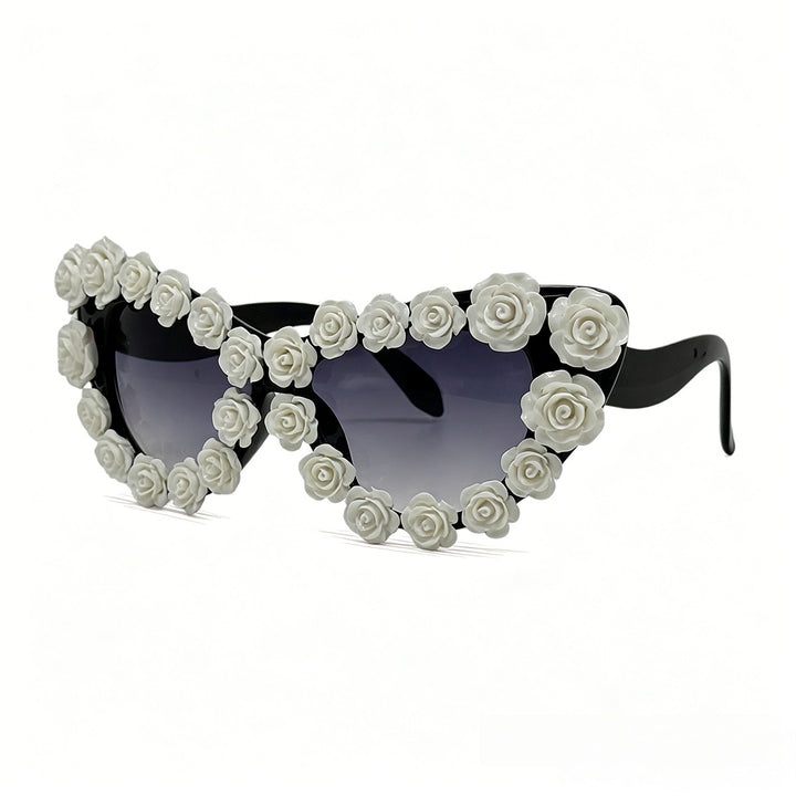 Damen hjerteformet solbrille med blomsterapplikasjon Skanto
