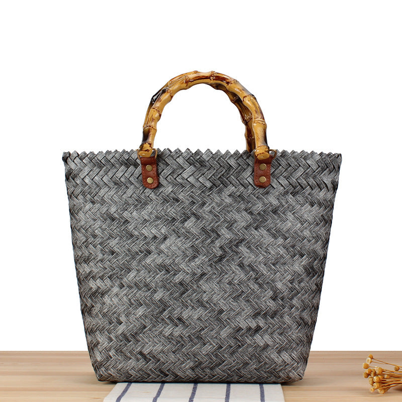 Handbag made of high-quality, braided material with bamboo handle Skanto