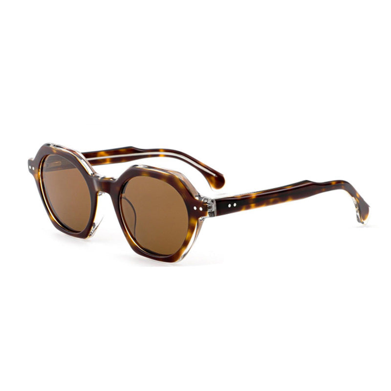 Dame solbrille i stilfull, sekskantet design med robust ramme og UV-beskyttelse Skanto