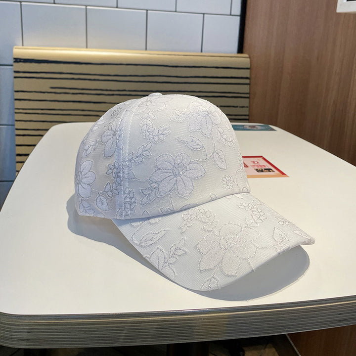 Kvinnens blomsterbroderte baseballcap Skanto