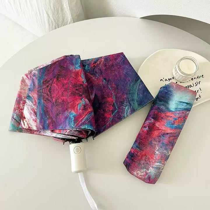 Dame sammenleggbart paraply med kreativt kunstdesign Skanto