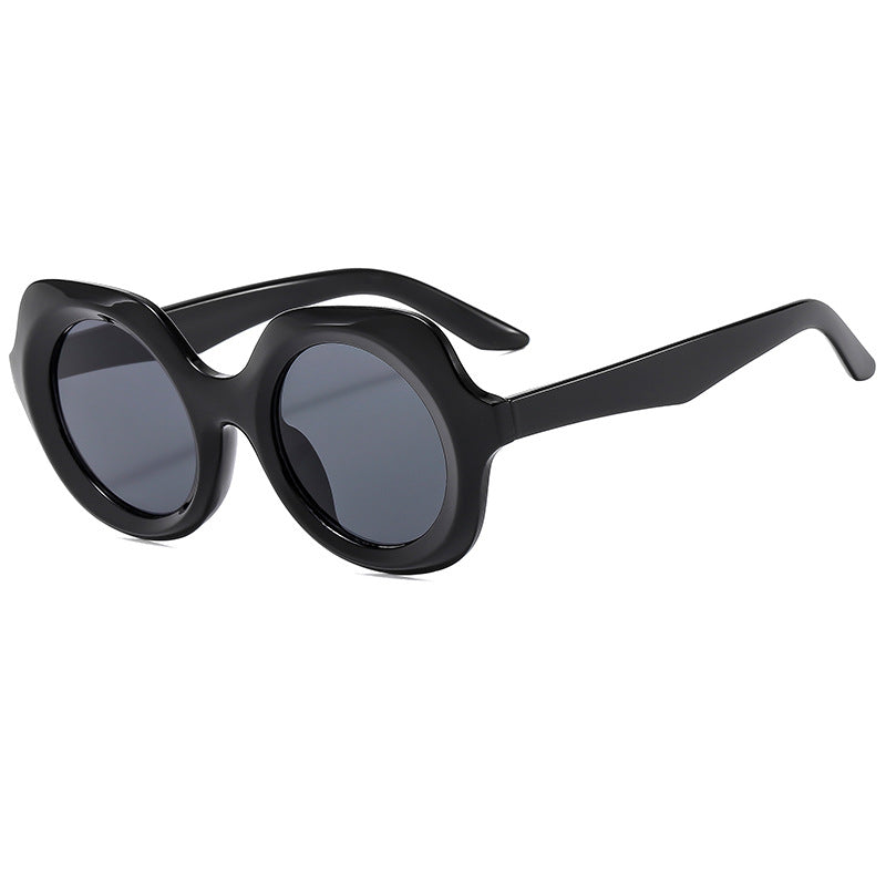 Dame oversized solbriller med stilige, buede rammer Skanto