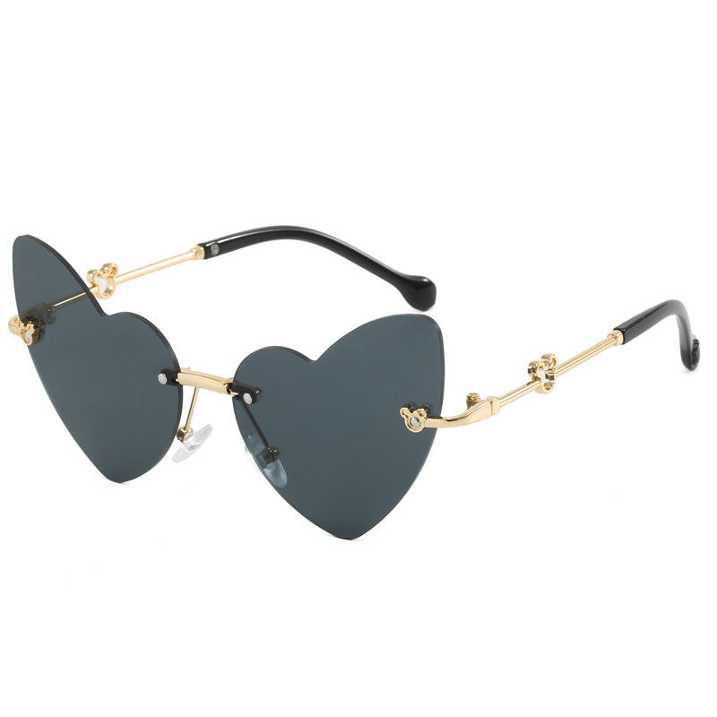 Damer hjerteformet solbrille med dekorert ramme Skanto