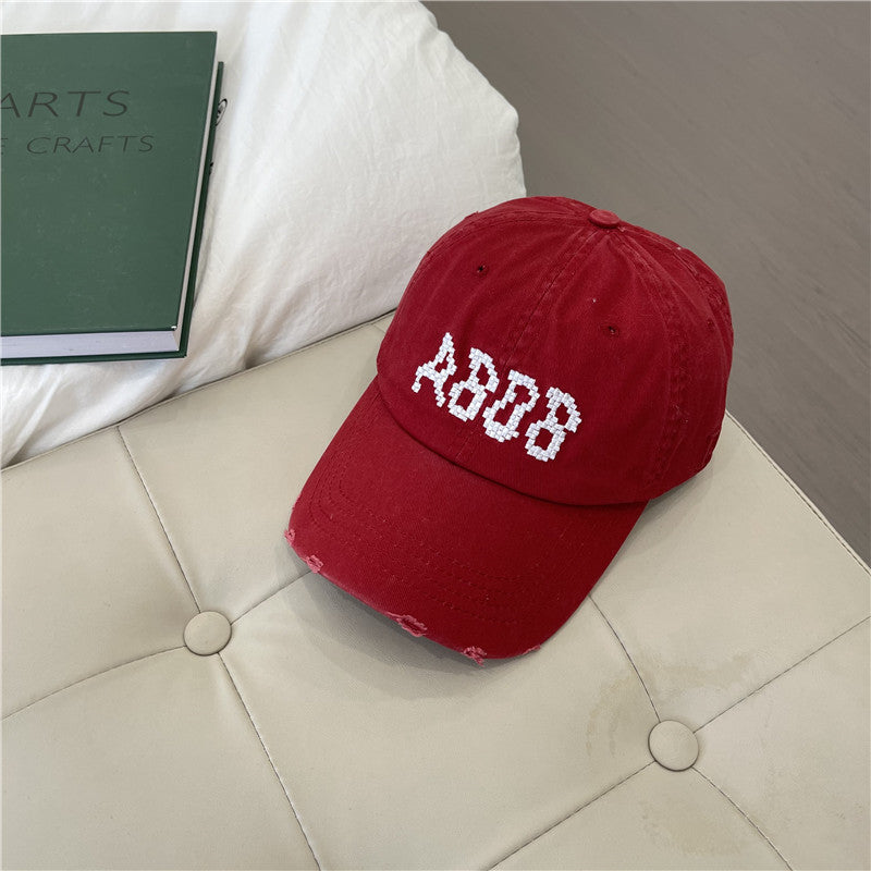 Kvinnens slitte bomull baseballcaps med grafisk detaljer Skanto