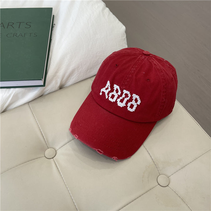 Kvinnens slitte bomull baseballcaps med grafisk detaljer Skanto