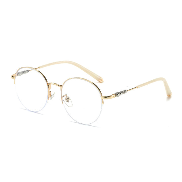 Dame rund solbrille med elegant metallramme og komfortable nesepads Skanto