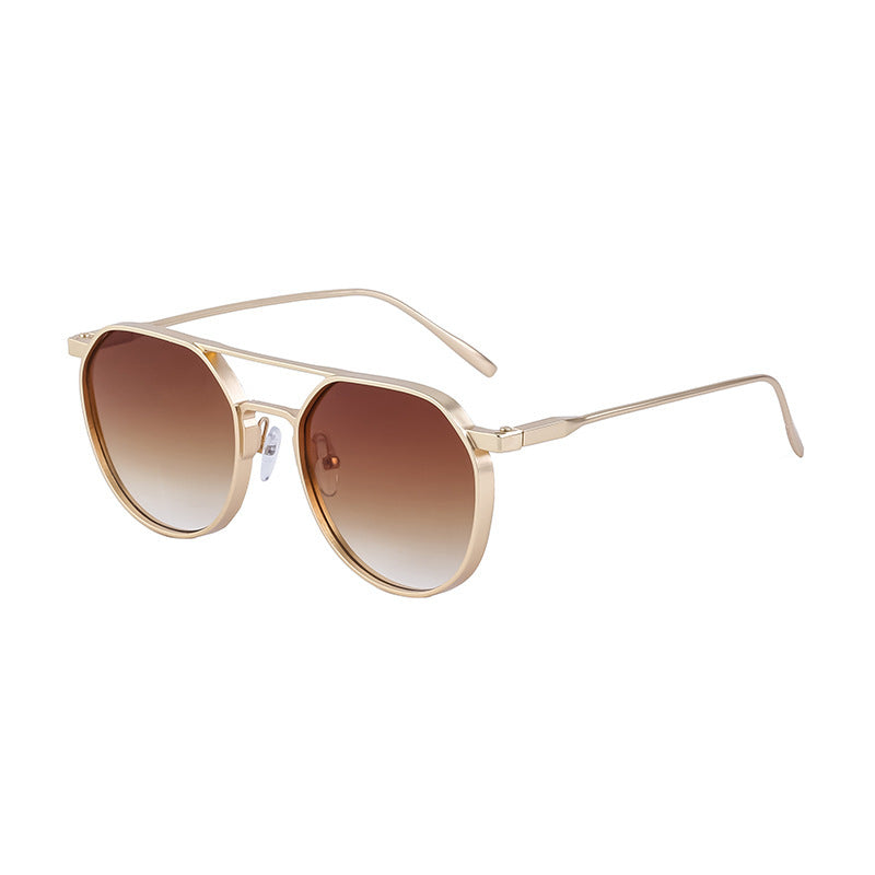 Dame moterik solbrille i stilfullt rundt design Skanto