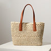 Braided straw basket with sturdy leather handles Skanto