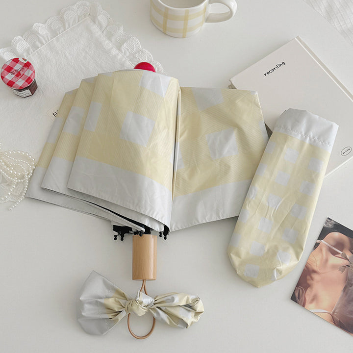 Dame sammenleggbart paraply med spesiell design Skanto
