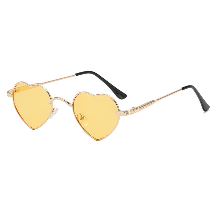 Damer hjerteformet solbrille med filigran metallramme Skanto
