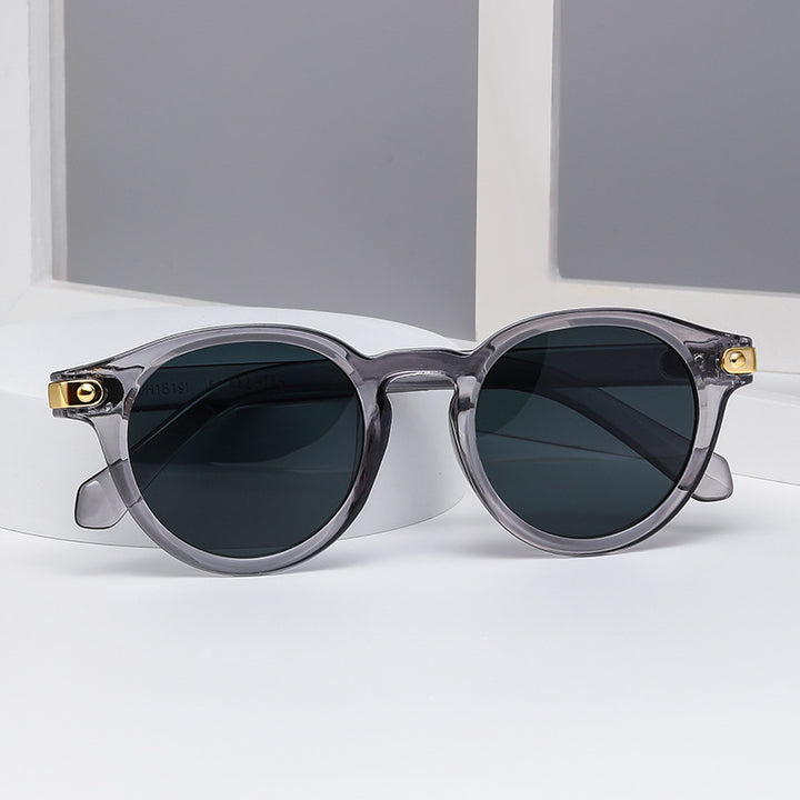 Dame moteriktig solbrille med transparent ramme og robuste glass Skanto