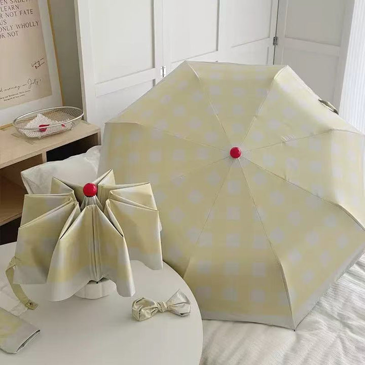 Dame sammenleggbart paraply med spesiell design Skanto
