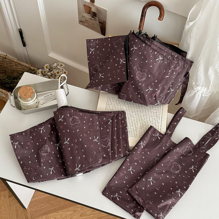 Dame sammenleggbart regnparaply med elegant anhengdesign Skanto